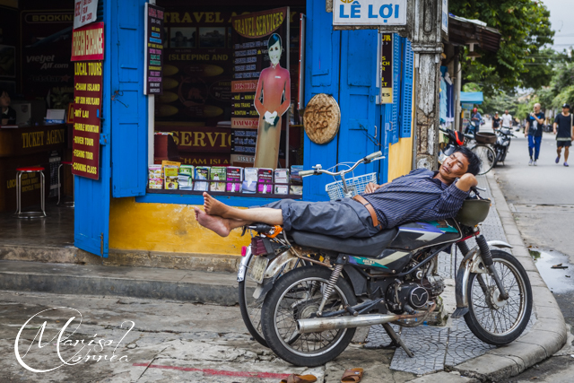 Man taking a nap on a bike